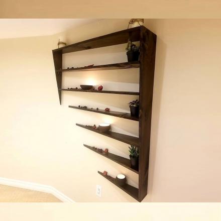 This Unique Shelf Design Looks Like It’s Disappearing Into The Wall