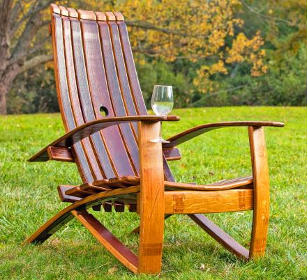 This Adirondack Chair Is Made From an Old Wine Barrel and Has a Slot For a Wine Glass